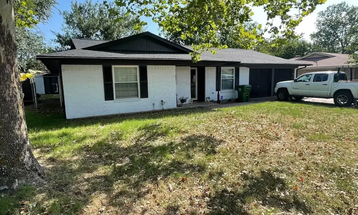 Professional roofing crew working on a residential roof in Towson